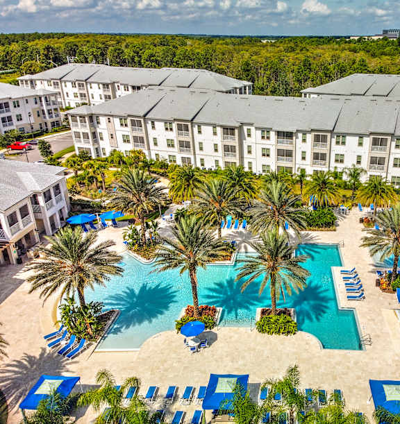 an aerial view of 2 beach entry pools