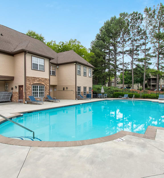 the preserve at ballantyne commons pool and resort style building with trees