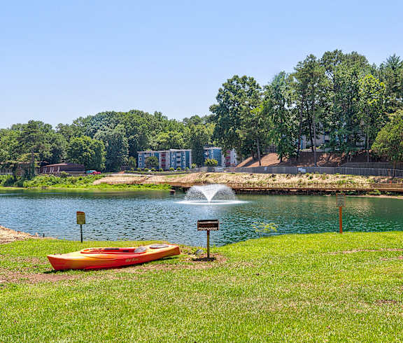a park with a lake and a fountain