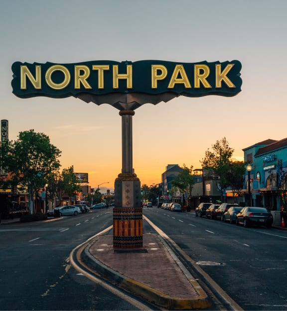 a sign for north park on the corner of a city street