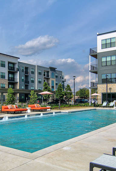 our apartments have a large pool and lounge chairs
