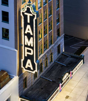 a view of the tampa sign from the top of a building at night