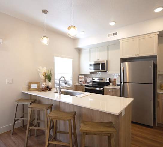 Kitchen with an Island at Desert Sage Townhomes
