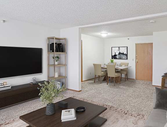 A living room with a grey couch and a wooden coffee table.