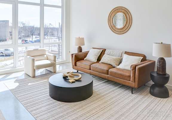 a living room with a white couch and a coffee table at Anthem at Square 10 in New Haven, CT 06511