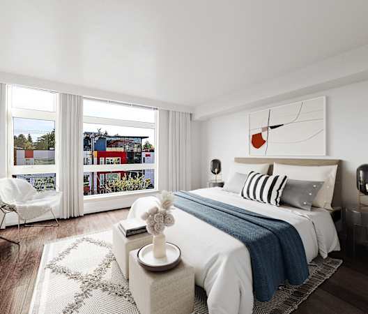 a bedroom with a bed and a large window at The Hayes on Stone Way, Seattle, WA, 98103