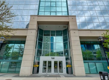 a building with large glass windows and doors