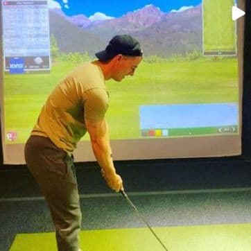 a man is playing a video game with a stick