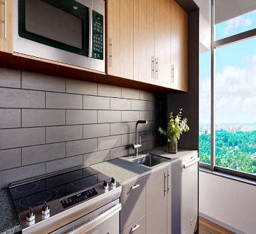 a kitchen with a stove and a sink next to a window
