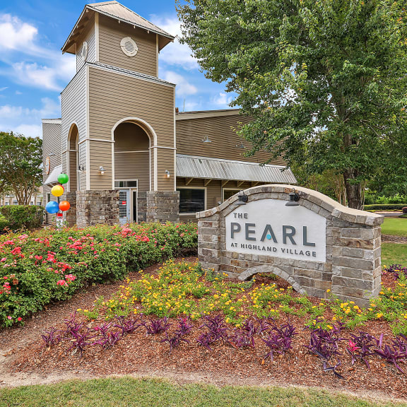 an image of the pearl elementary school sign with the school building in the background