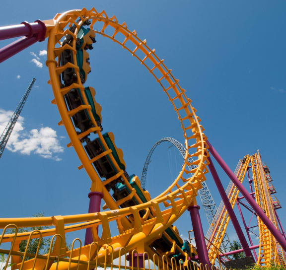 a roller coaster in the sky at a theme park