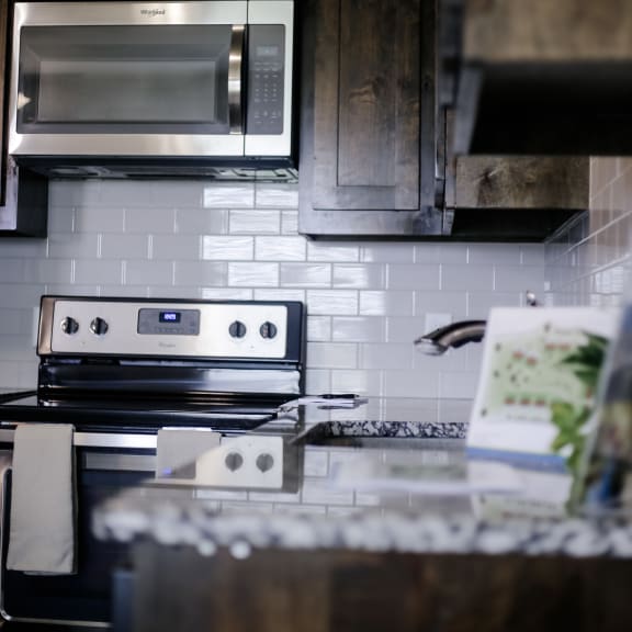 a kitchen with a stove and a microwave