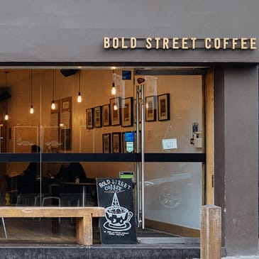a brick wall with a bar and a sign on it that reads rocking bird bar
