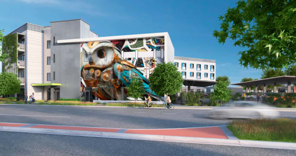 a rendering of a building with a mural on the side of it