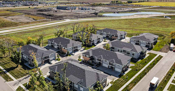 A large group of houses are shown from an aerial view.
