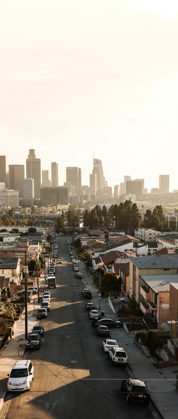the city with cars parked on the street