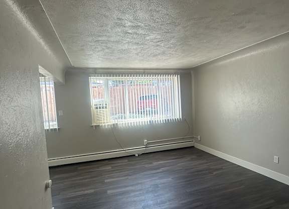 A hallway with a window and a door.