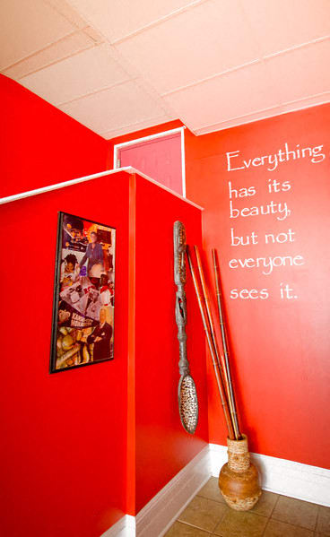 Lobby decorations with red walls and wooden vase and bamboo sticks