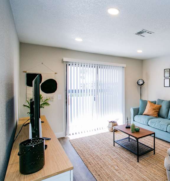 a living room with a couch and a chair and a table