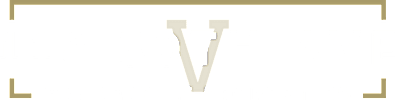 A black and gold sign for Vanderbilt Properties.