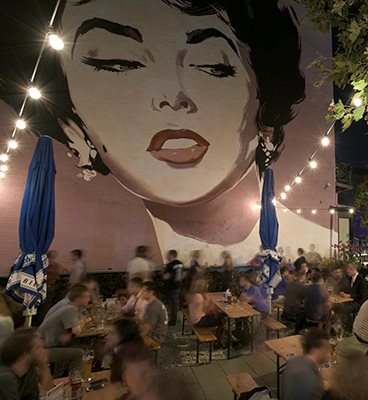 Vibrant cafe at night near The Hudson Apartments, Washington, DC 20005
