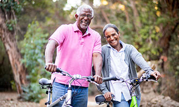Seniors on bikes stock image