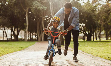 boy cycling at Piedmont Park Apartments, Hattiesburg, MS, 39401
