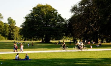 A group of people are enjoying a sunny day in the park.