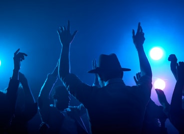 a crowd of people with their hands in the air at a concert at The Apex at CityPlace, Overland Park, 66210