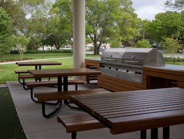 grills and picnic tables under covered pavilion