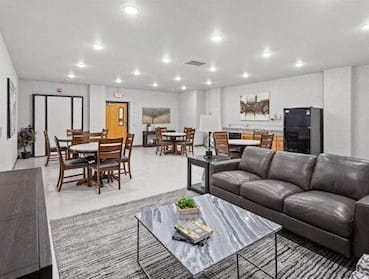 Muskego School Apartments community room with plenty of seating
