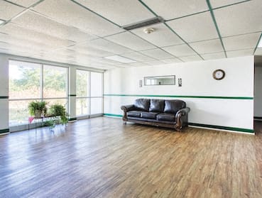 Lobby Sitting area with couch and large windows