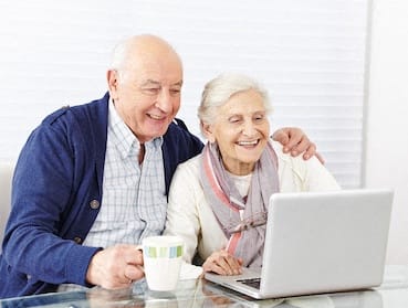 Campus Towers Apartments in Jacksonville, FL older couple searching on laptop