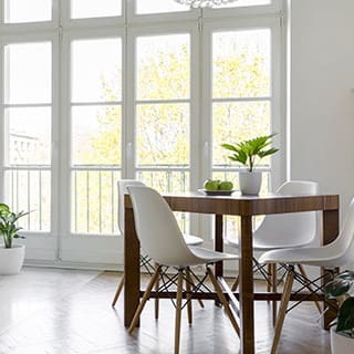 a dining room with a table and chairs