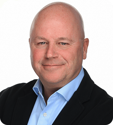 a man in a suit and a blue shirt