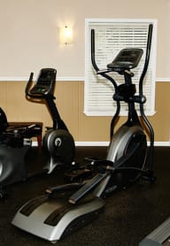 two exercise bikes in a gym