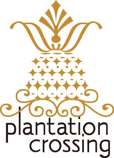 A black and gold logo for plantation crossing.