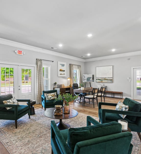 a living room with a white couch and pillows