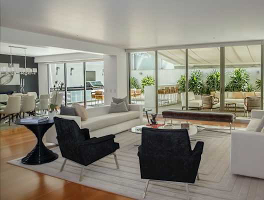 A modern living room with black and white furniture.