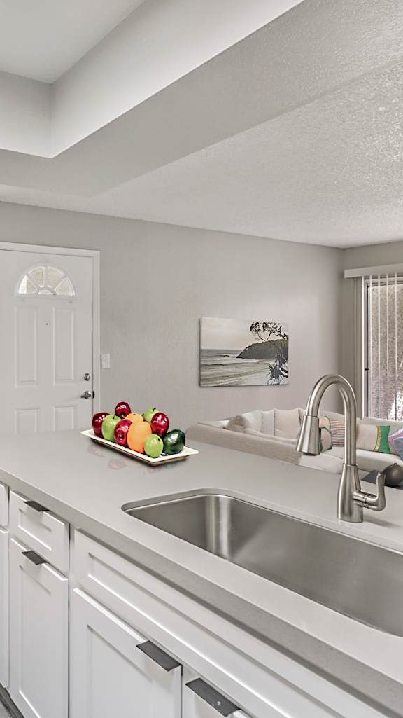 A modern kitchen with a dining table and chairs.