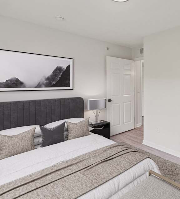 a bedroom with a bed and a kitchen and a living room