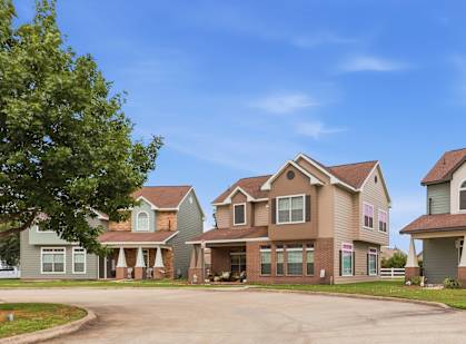A large house with a driveway in front of it.