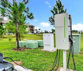 Electric car station at POINTE AT EAST SHORE APARTMENTS, APOPKA, FL
