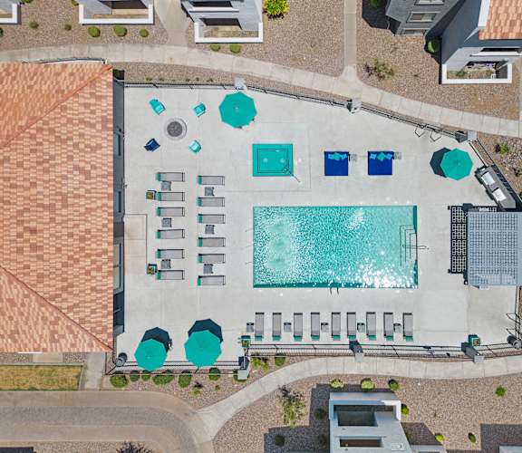 arial view of a building with a large swimming pool