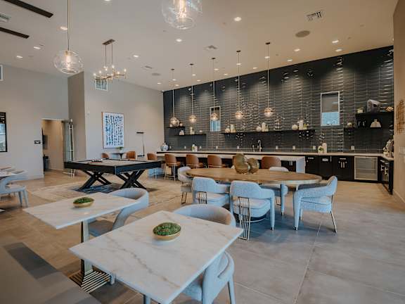 Large modern clubhouse with cafe seating at Level 25 at The Curve by Picerne, Las Vegas