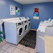 A laundromat with washers and dryers.