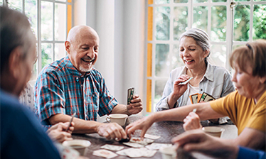 Group of people playing cards