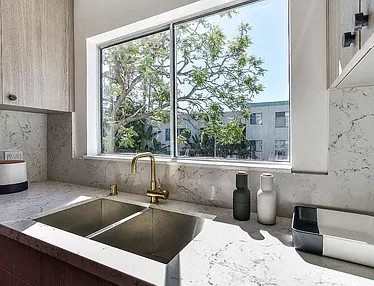 a kitchen with a sink and a window at 8535 Colgate-Fully Furnished Apartments, Los Angeles