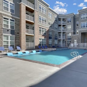 The Edison at Wheat Ridge Apartments in Wheat Ridge, Colorado Pool with Lounge Chairs