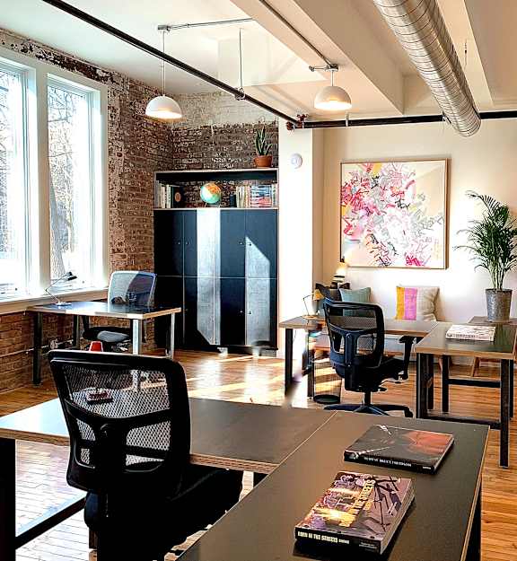 A modern office space with desks and computers.